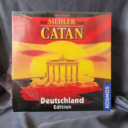 ie Siedler von Catan – Deutschland Edition Brettspiel von Kosmos, Sonderausgabe mit Brandenburg Tor auf dem Cover, Strategiespiel von Klaus Teuber, EAN 4002051693015