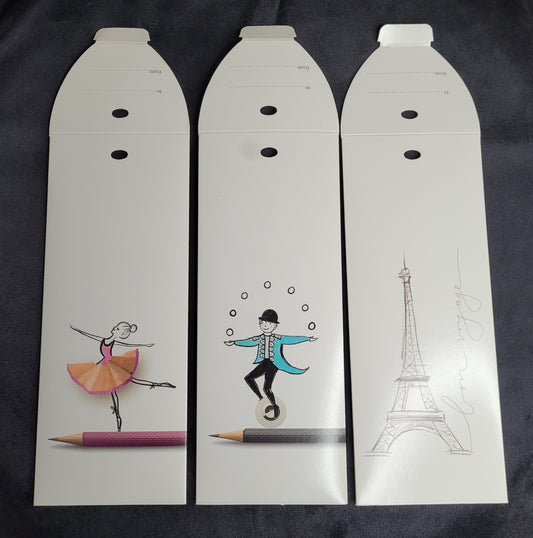 Drei Geschenkkarten von Graf Faber Castell, designed by Kara Till, mit Illustrationen einer Ballerina, eines Jongleurs und des Eiffelturms.