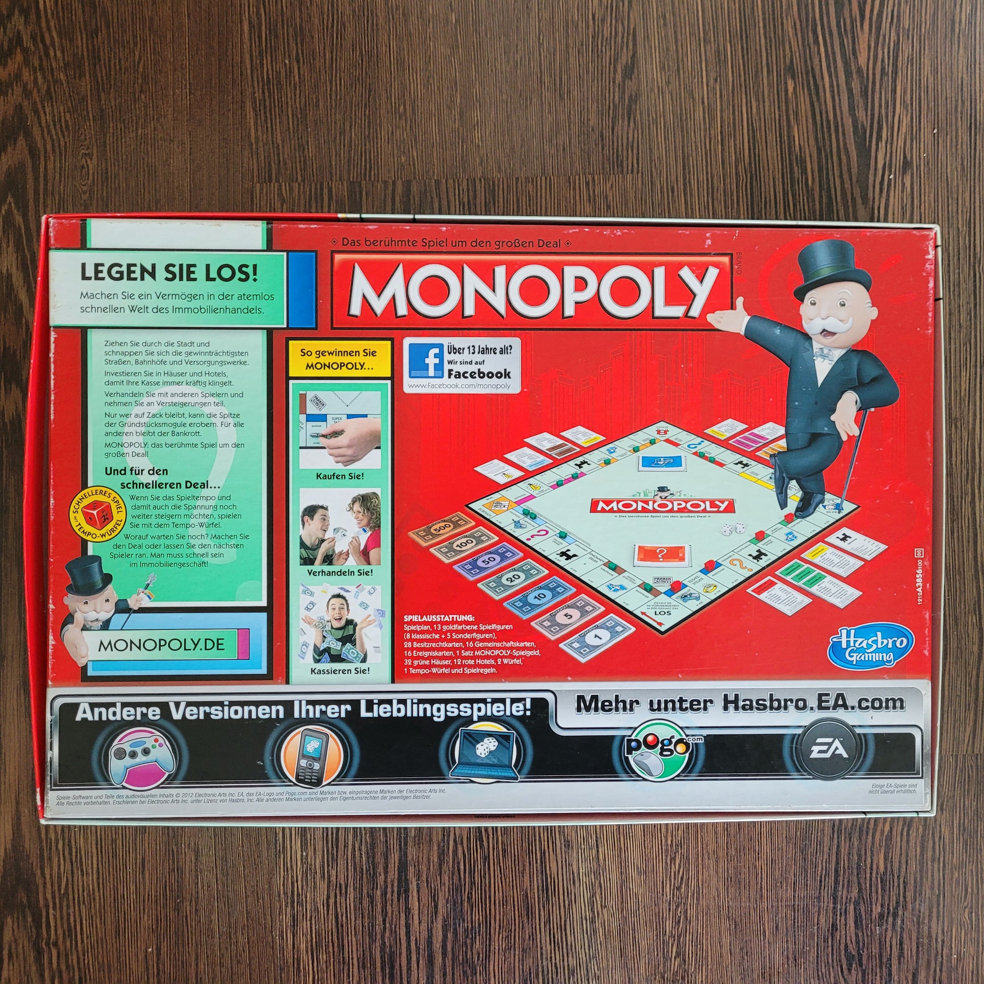 Rückseite der Monopoly Limitierte Ausgabe Verpackung von Hasbro. Darstellung des Spielbretts, goldenen Spielfiguren, Spielmaterial und Spielanleitung. Limitierte Ausgabe für Sammler.