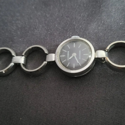 Klassische Dugena Jeunesse Automatik Armbanduhr mit rundem Gehäuse und filigranem Armband im Vintage-Stil.