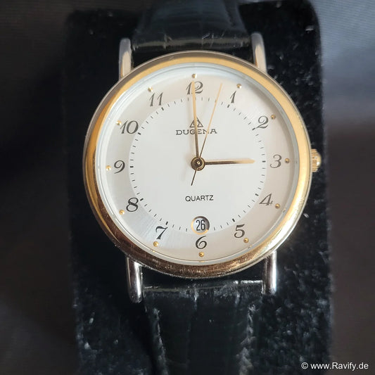 Klassische Vintage Dugena Quartz Armbanduhr für Damen und Herren mit hellem Zifferblatt, silberfarbenem Gehäuse und schwarzem Genuine-Leather-Armband.
