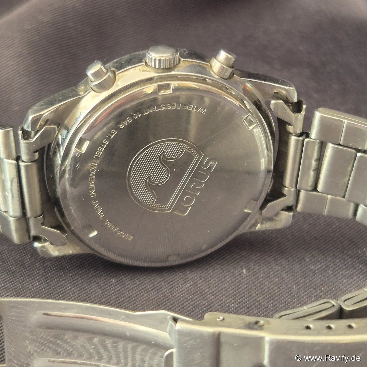 Lorus Chronograph V657-X052 Edelstahl Gehäuseboden mit Wellenlogo