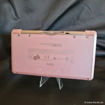 Nintendo 3DS XL Konsole in Pink und Rosa auf Stoffhintergrund. Rückseite.